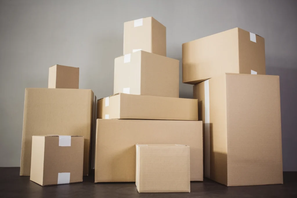 Assorted moving boxes stacked together