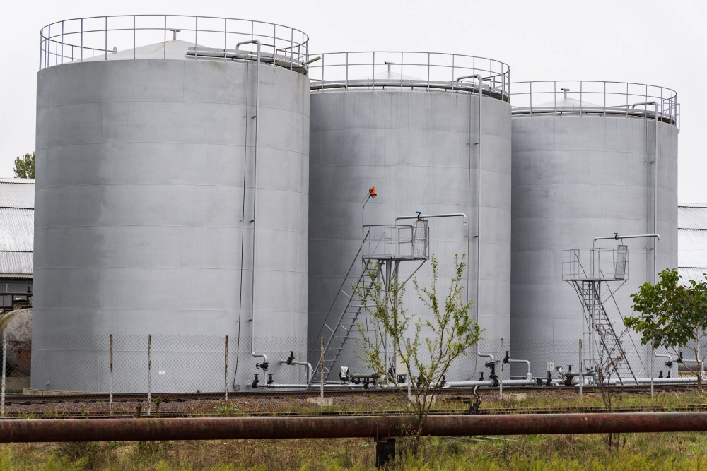 Three cylindrical tanks with ladders