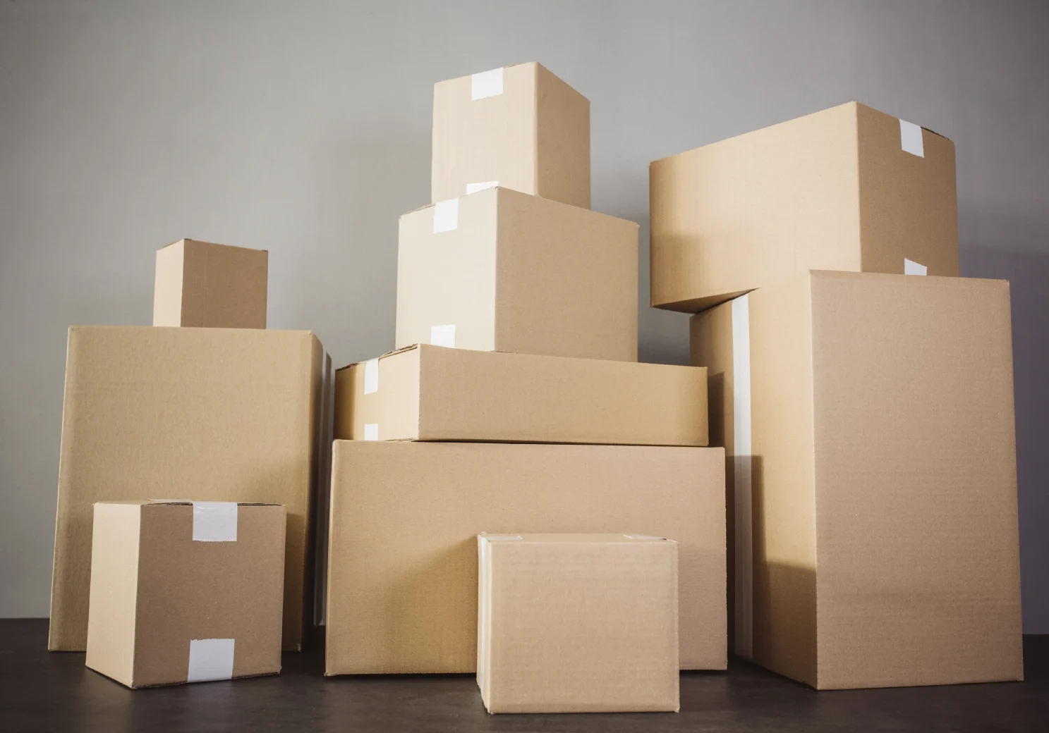 Assorted moving boxes stacked together