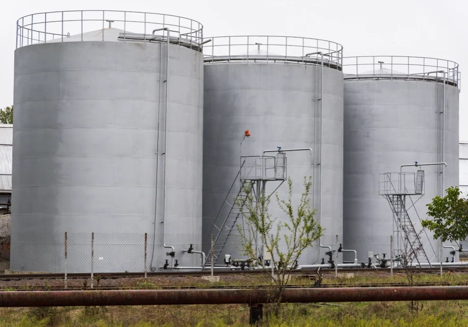 Three cylindrical tanks with ladders